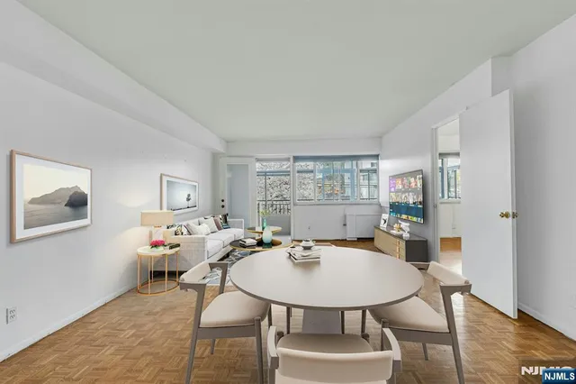 a view of a dining room with furniture and wooden floor