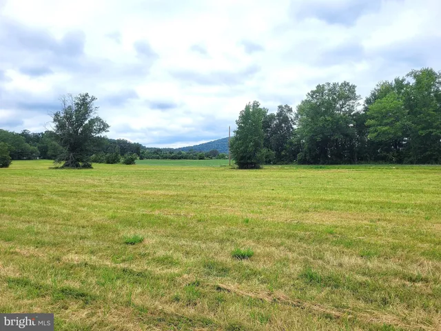 a view of a swimming pool with an outdoor space and seating area