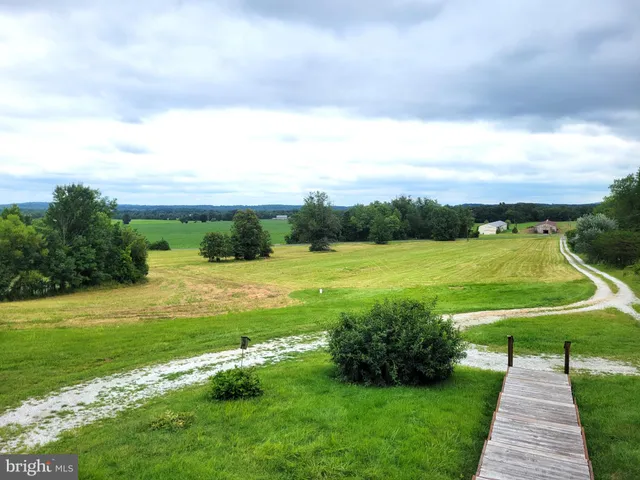a view of a golf course with a big yard