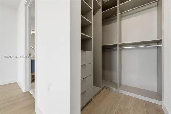 a view of an empty walk in closet