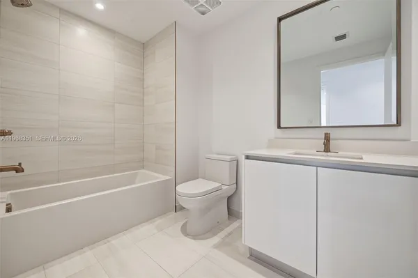 a view of a hallway with washer and dryer