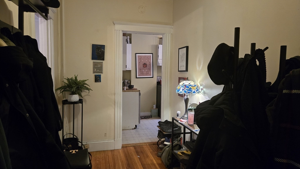 1986 Commonwealth, Unit 4 Boston, MA 02135 - Photo 6 of 10 a living room with furniture and a closet