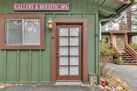 a view of a livingroom with furniture and windows