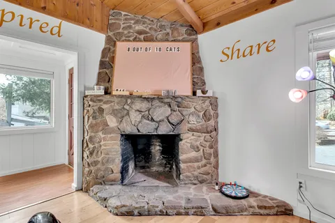 a dining room with furniture and wooden floor