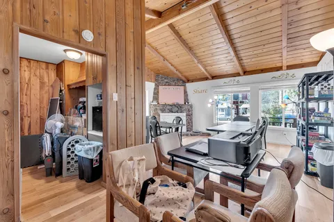 a open kitchen with stainless steel appliances granite countertop a stove refrigerator and cabinets