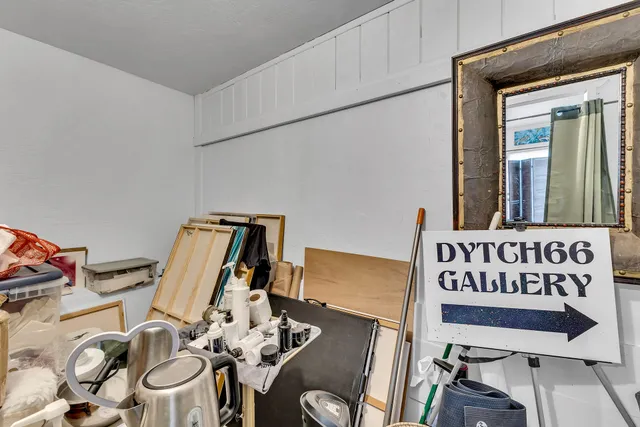 a bed room with a bed and a chair