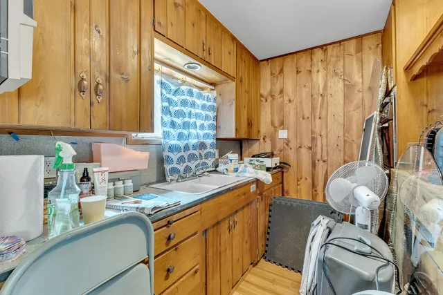a living room with furniture and a book shelf