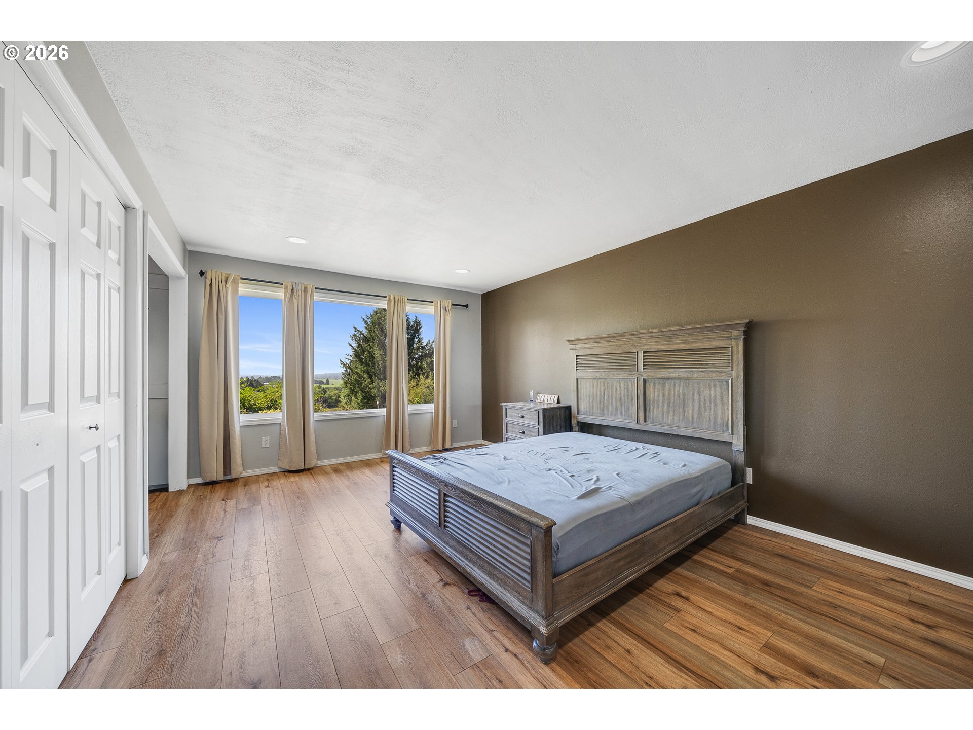 850 Hodgdon Road Tillamook, OR 97141 - Photo 14 of 43 a bedroom with a bed and wooden floor
