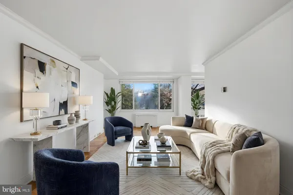 a living room with furniture or couch and a large window