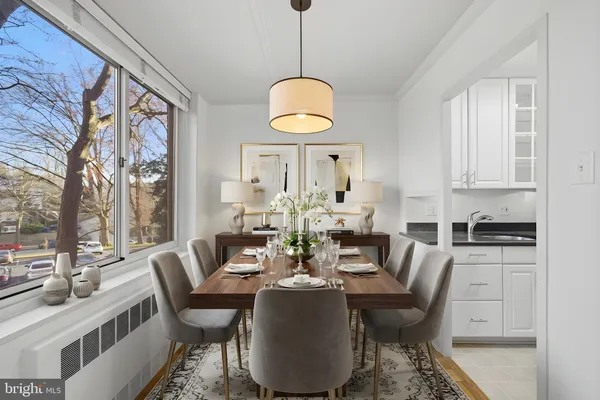 a view of a dining room with furniture window and outside view