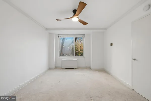 a view of an empty room with a window