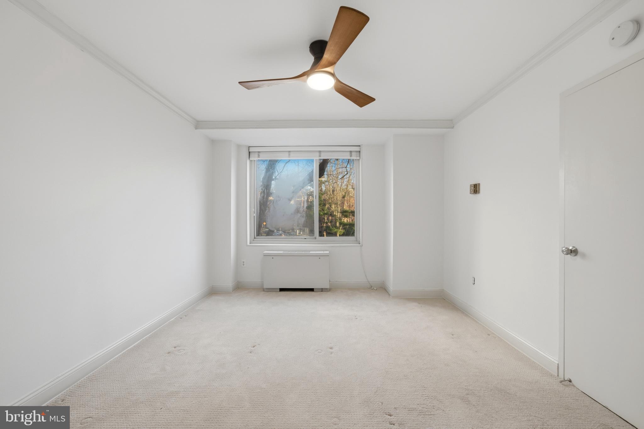 4000 Tunlaw Road Northwest, Unit 220 Washington, DC 20007 - Photo 25 of 30 a view of an empty room with a window