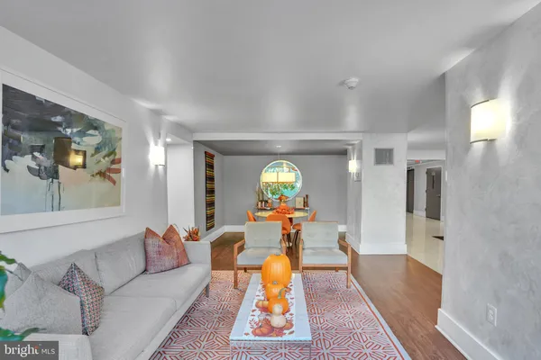 a living room with furniture and a clock