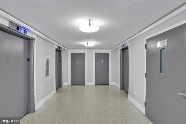a view of a hallway with front door