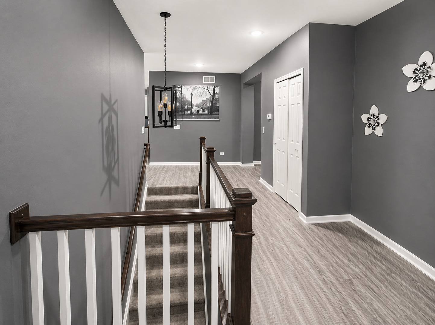 713 Long Ridge Trail Minooka, IL 60447 - Photo 13 of 40 a view of a hallway with wooden floor and stairs