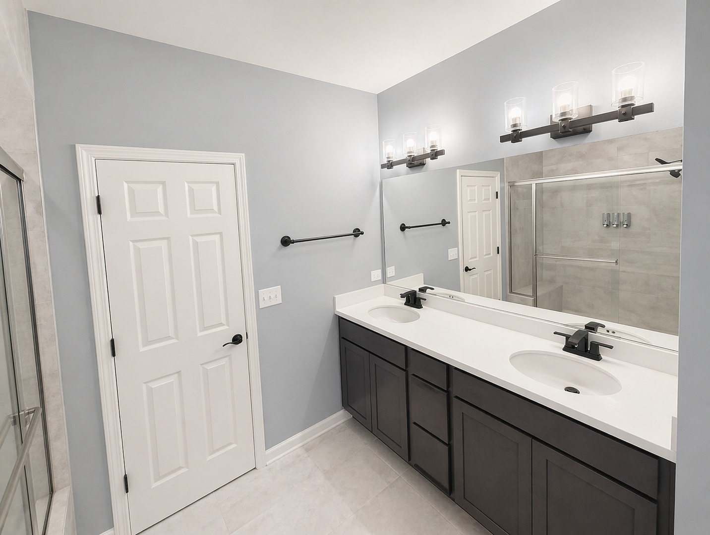 713 Long Ridge Trail Minooka, IL 60447 - Photo 34 of 40 a bathroom with a double vanity sink a mirror and a shower