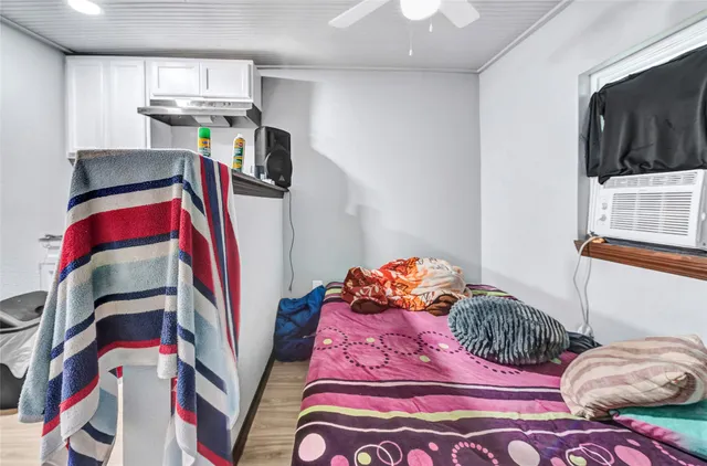 a bedroom with a bed and dresser