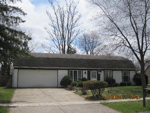 36 Pembrooke Road Montgomery, IL 60538 - Photo 1 of 1 a front view of house with yard and trees around