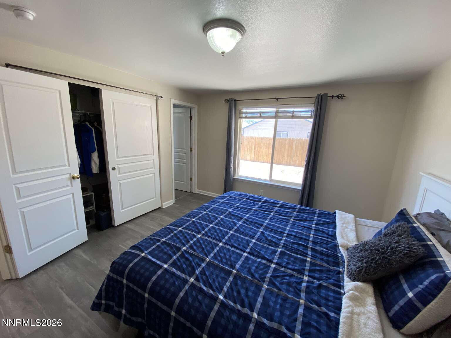 621 Keppel Street Fallon, NV 89406 - Photo 11 of 15 a bedroom with a bed and a window