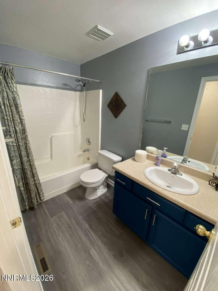 621 Keppel Street Fallon, NV 89406 - Photo 5 of 15 a bathroom with a sink a toilet and shower