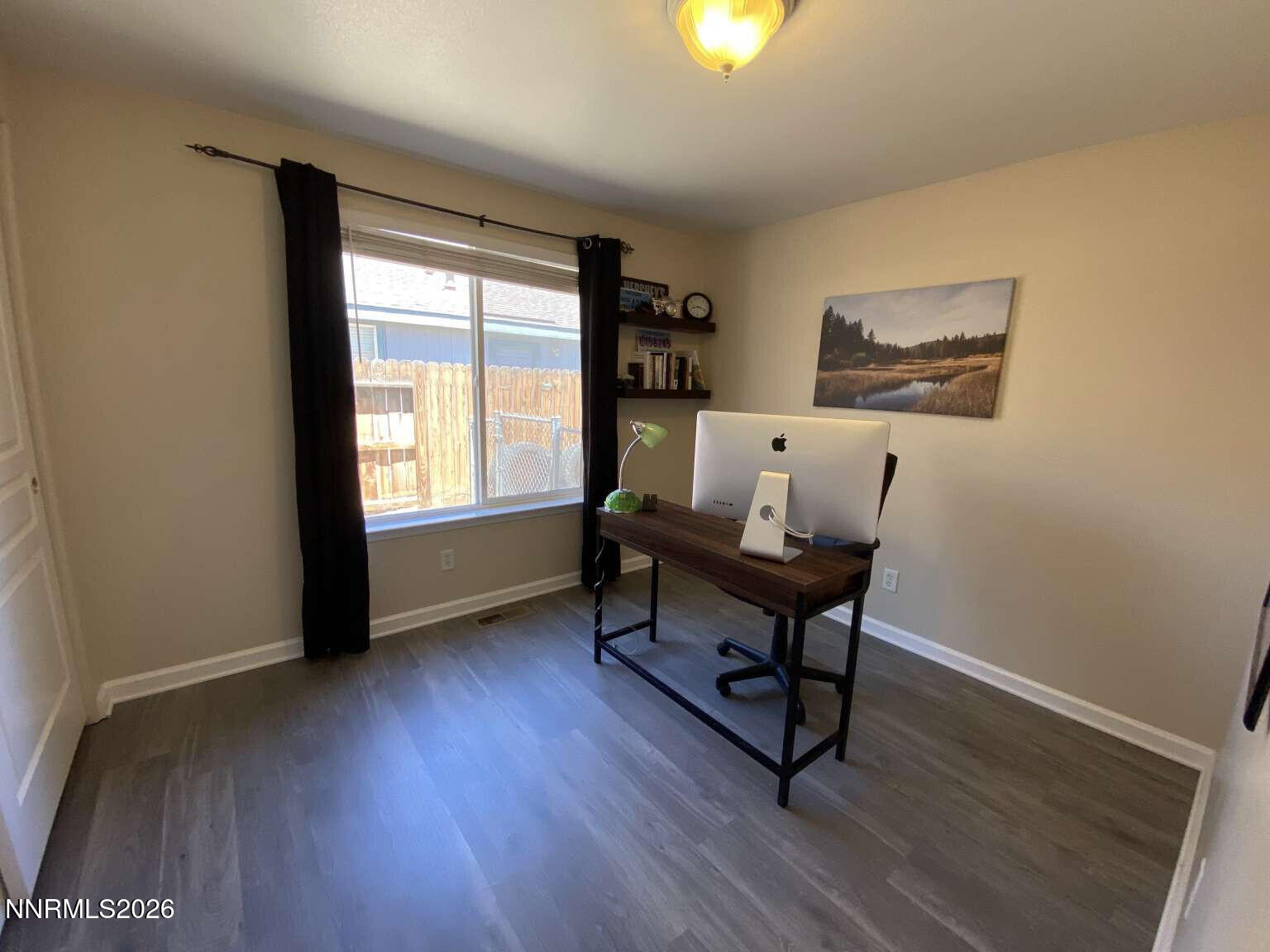 621 Keppel Street Fallon, NV 89406 - Photo 8 of 15 a view of a workspace with furniture and a window