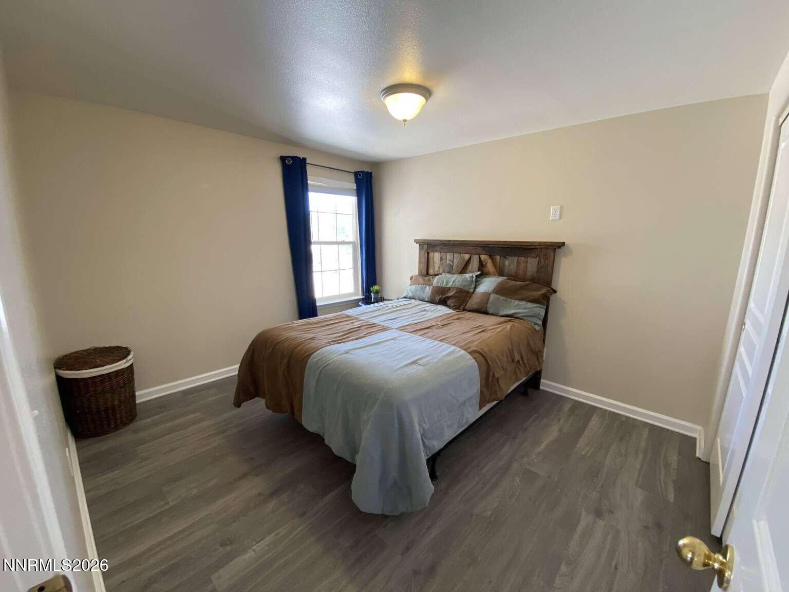 621 Keppel Street Fallon, NV 89406 - Photo 9 of 15 a bedroom with a bed and a window