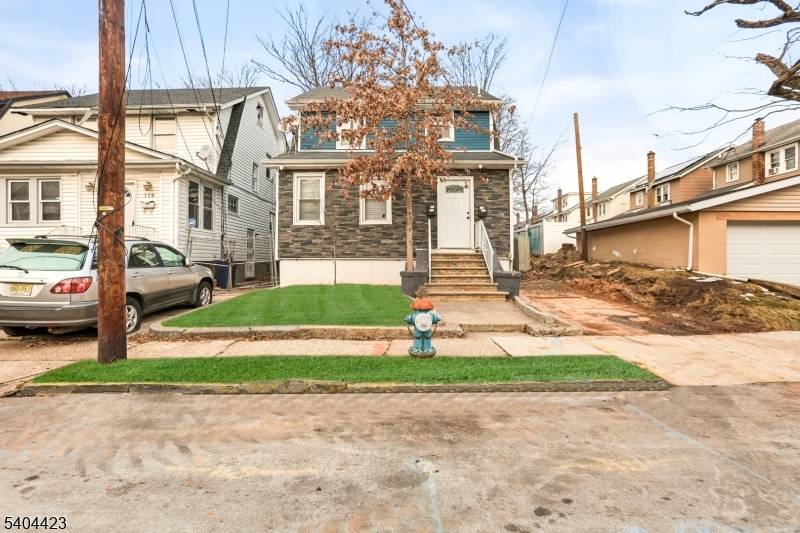 112 University Place Irvington, NJ 07111 - Photo 1 of 31 a view of a street with cars parked in front of it