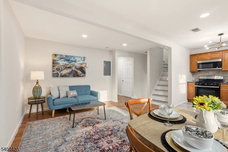 112 University Place Irvington, NJ 07111 - Photo 17 of 31 a living room with furniture and a fireplace