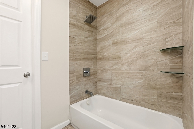 112 University Place Irvington, NJ 07111 - Photo 20 of 31 a bathroom with a bathtub