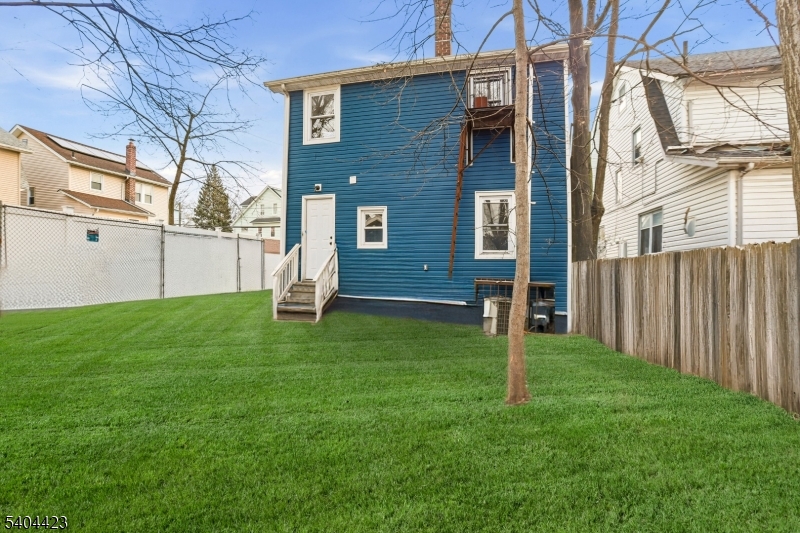112 University Place Irvington, NJ 07111 - Photo 30 of 31 a backyard of a house with lots of green space