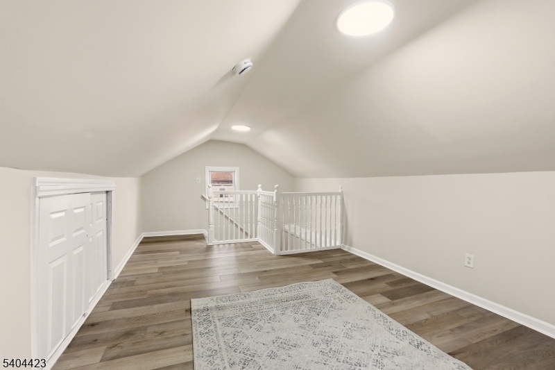112 University Place Irvington, NJ 07111 - Photo 10 of 31 wooden floor in an empty room with a window