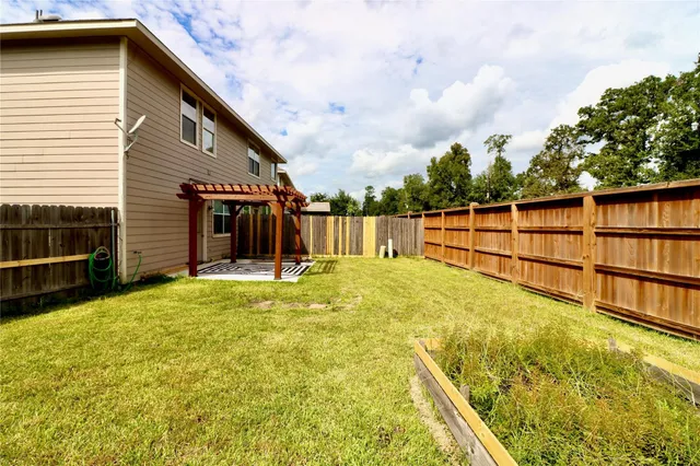 a view of a backyard with swimming pool