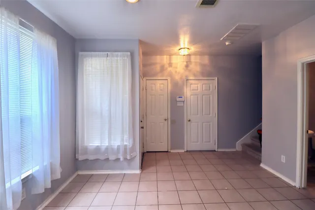 a view of an empty room and window