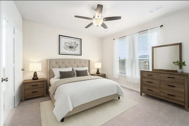 an empty room with closet and ceiling fan