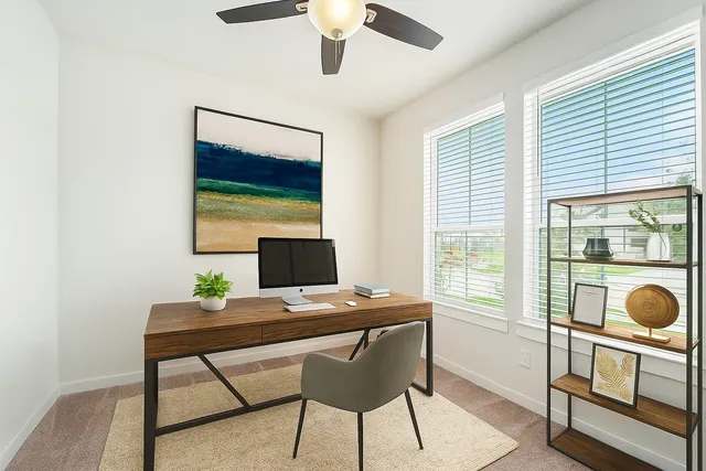 a workspace with furniture and a window