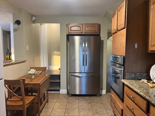 5582 Pocusset Street Pittsburgh, PA 15217 - Photo 14 of 29 a kitchen with a refrigerator a stove and a refrigerator