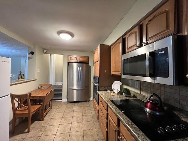 5582 Pocusset Street Pittsburgh, PA 15217 - Photo 17 of 29 a kitchen with refrigerator and cabinets
