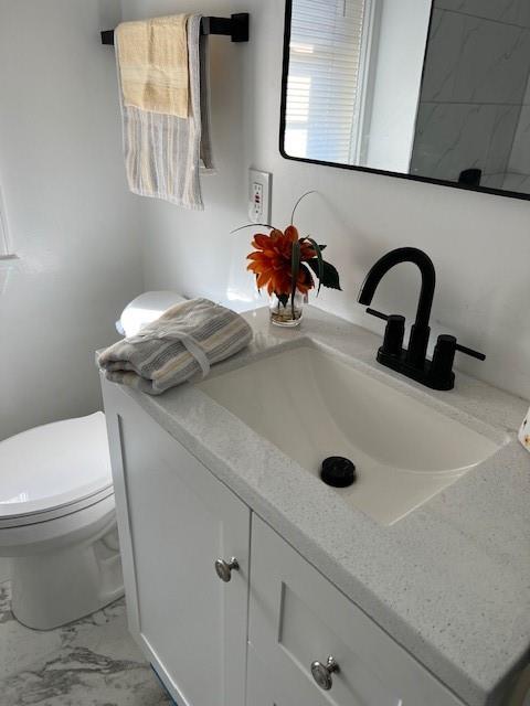 5582 Pocusset Street Pittsburgh, PA 15217 - Photo 18 of 29 a bathroom with a sink and a toilet
