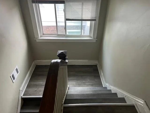 a view of a porch with furniture and garden