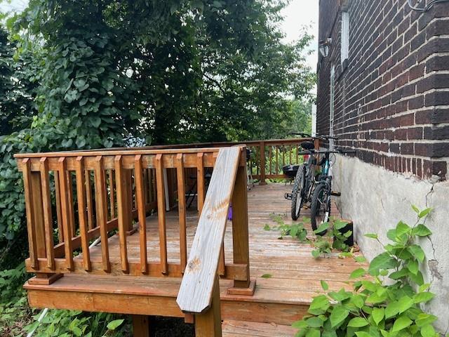 5582 Pocusset Street Pittsburgh, PA 15217 - Photo 28 of 29 a view of wooden deck with chair and wooden fence