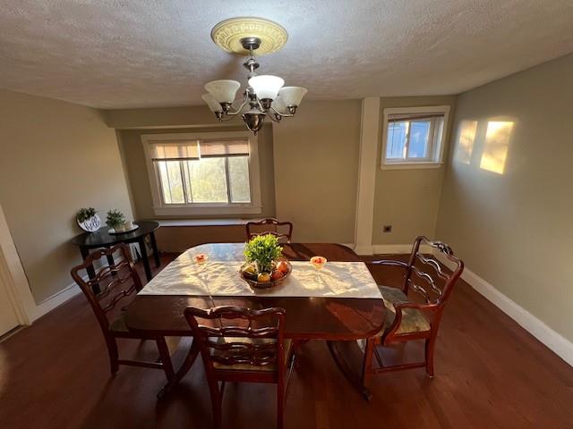 5582 Pocusset Street Pittsburgh, PA 15217 - Photo 5 of 29 a view of a dining room with furniture and chandelier