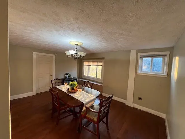 a dining room with a table and chairs