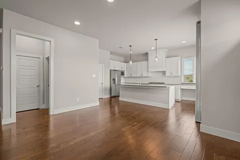 a view of kitchen with wooden floor
