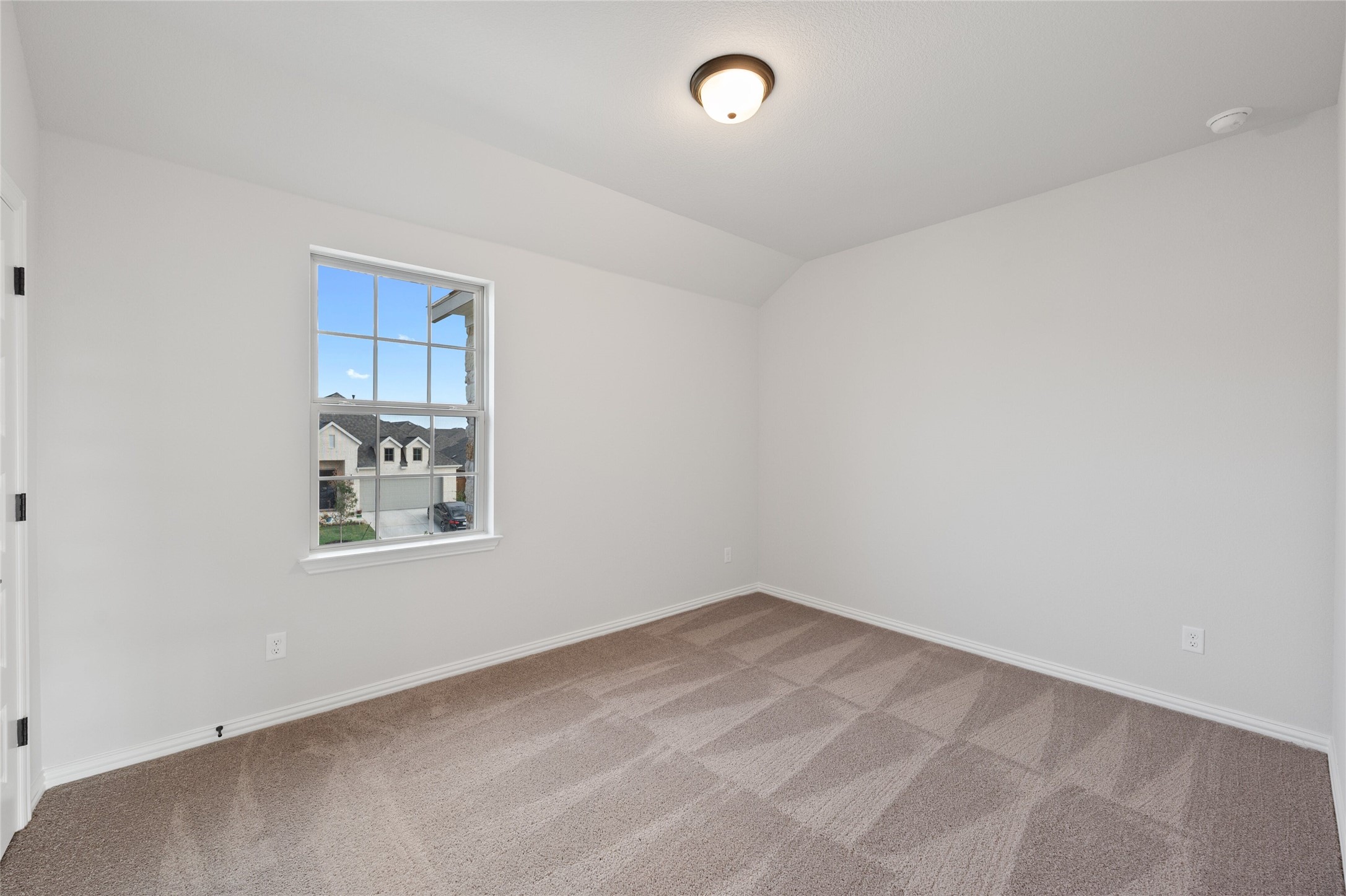 303 Fawn Riv Run Kyle, TX 78640 - Photo 22 of 32 Neutral-toned carpeted room with white walls