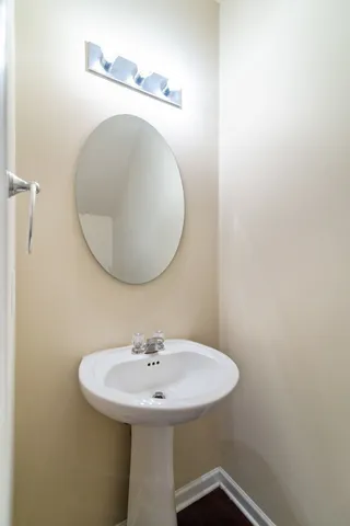 a bathroom with a sink and mirror