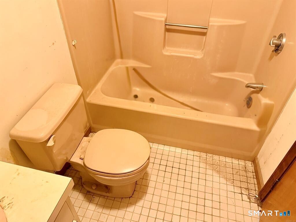 817 Woodtick Road, Unit A Waterbury, CT 06705 - Photo 14 of 16 a bathroom with a toilet and a sink