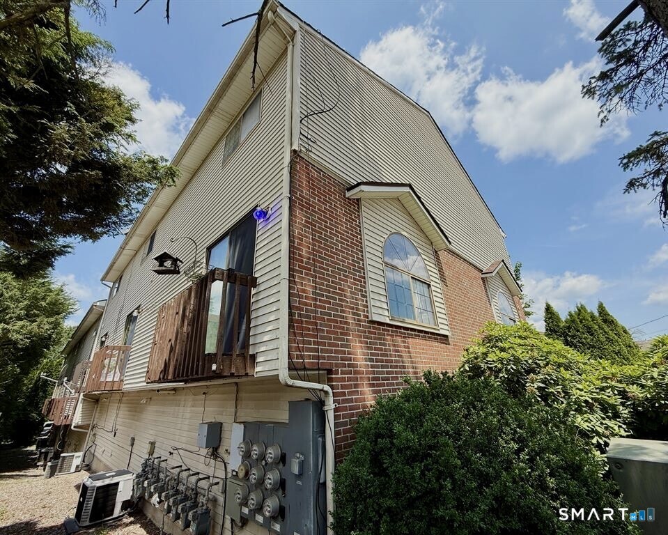817 Woodtick Road, Unit A Waterbury, CT 06705 - Photo 16 of 16 a view of a house with a street