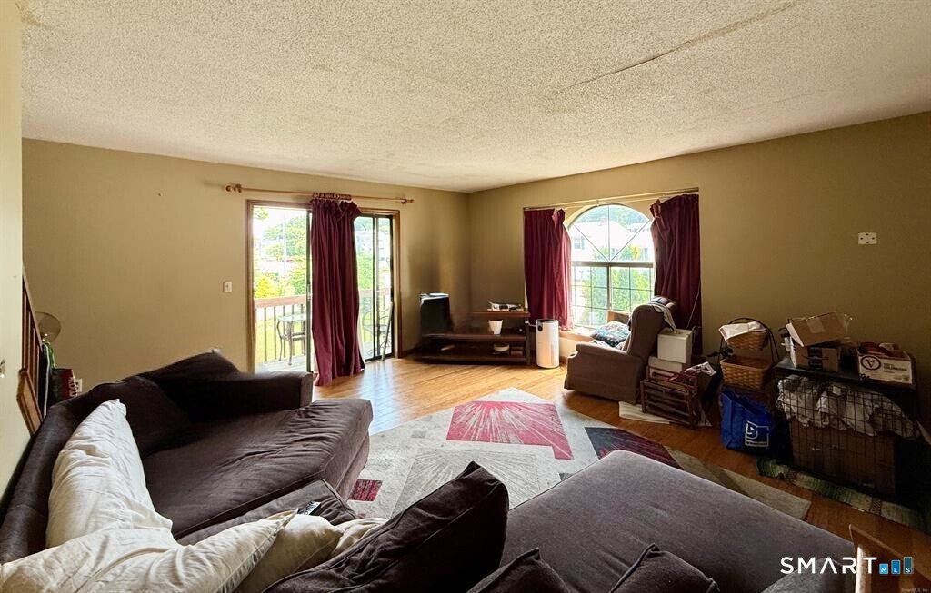 817 Woodtick Road, Unit A Waterbury, CT 06705 - Photo 3 of 16 a living room with furniture window and a couch
