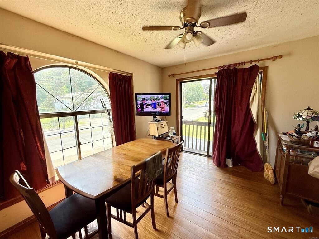 817 Woodtick Road, Unit A Waterbury, CT 06705 - Photo 6 of 16 a view of a dining room with furniture window and outside view