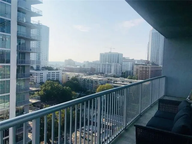 a view of a balcony with city view